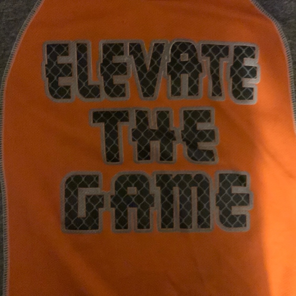 Black and orange elavate the game sleeveless shirt